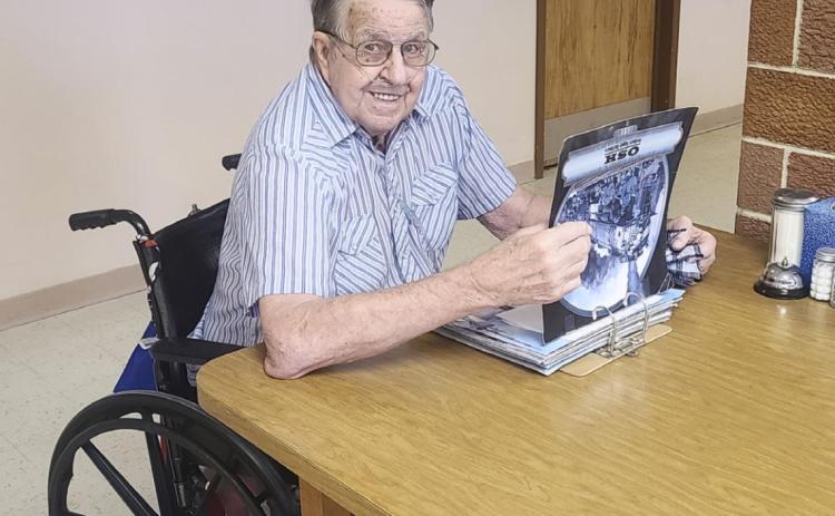 Robert Prentice enjoying the train book brought in by Ken Clark.