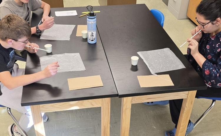 The Mullen 6th graders are learning about weather in science. They are exploring the properties of water and how it interacts in the atmosphere to create clouds and storms. Pictured are Cooper Cash, Bronx Burney and Pandora Gray. Tawn Jewell