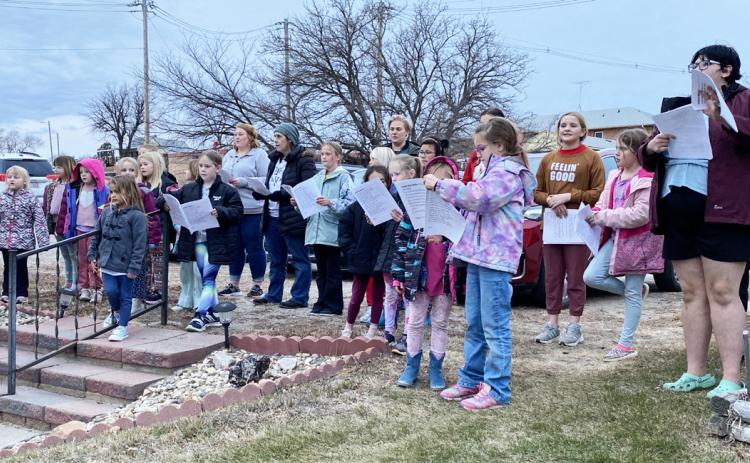 Girl Scouts go Christmas caroling
