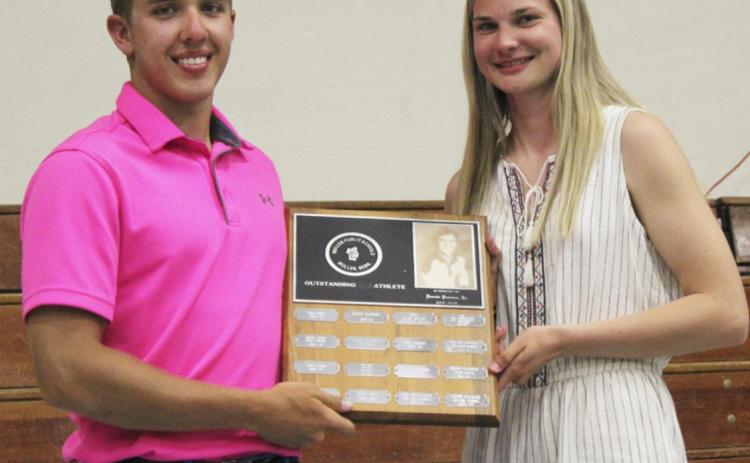 The Donnie Pearson Memorial Award is presented to outstanding senior female and male athletes every year. The 2021 recipients are pictured to the left - Brendon Walker and Samantha Moore.