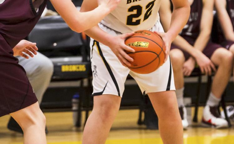 Deacon DeNaeyer on the court during the Broncos’ basketball game against Twin Loup last week. Megan Andersen