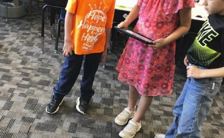 Second graders control robots