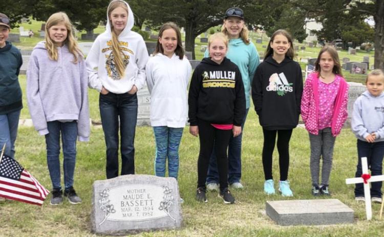 Girl Scouts decorate graves