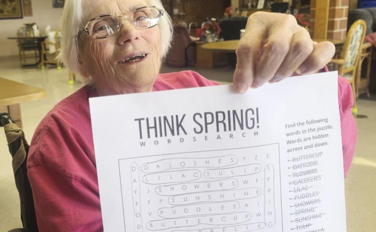 Marlene Dykes with her finished word find puzzle.