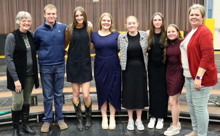 In her third year as the (K-8) music teacher, Mary Jo Walker also now has a high school choir class. The choir sang five songs at the Christmas Concert held at the Lariat last Tuesday, Dec. 2. They are pictured afterwards, l-r: Mary Lou Harding (piano accompanist), Hayden Morrison, Abigail Gracey, Maci Walz, Kassidy Cheever, Breckyn Burney, Audrabell Werth, Mary Jo Walker.