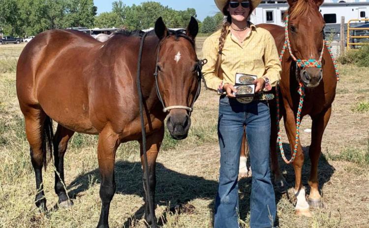 Whitney Jennings with her cutting and breakaway buckles at the North Platte High School Rodeo. Janelle Jennings