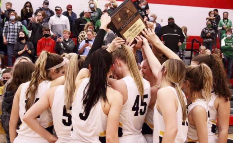 The Lady Broncos with the District Champion plaque last Friday. Sue Licking