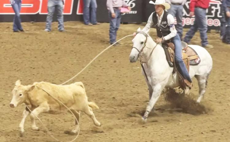 While riding her gray gelding, Tom, Chadron State College senior Brooke McCully of Mullen roped her calf in 2.4 seconds to place third in the final go-round of breakaway roping at the College National Finals Rodeo in Casper, Wyoming, last Saturday night. Steph Miller