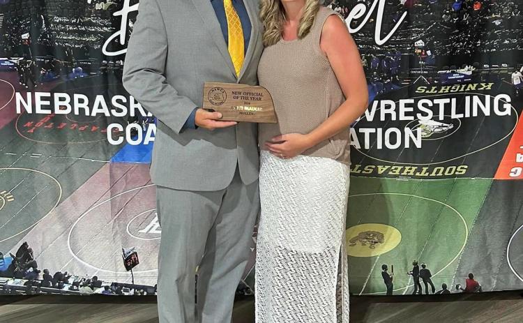 Brett Mauler of Mullen, pictured with his wife Shelby, was awarded the Nebraska Scholastic Wrestling Coaches Association New Official of the Year on June 7. Nominations for this award were made by coaches and then voted on by the members of the NSWCA. He officiated the All Star Red/Blue spotlight dual in Grand Island with NSWCA Official of the Year Austin Coufal of Howells. courtesy photo