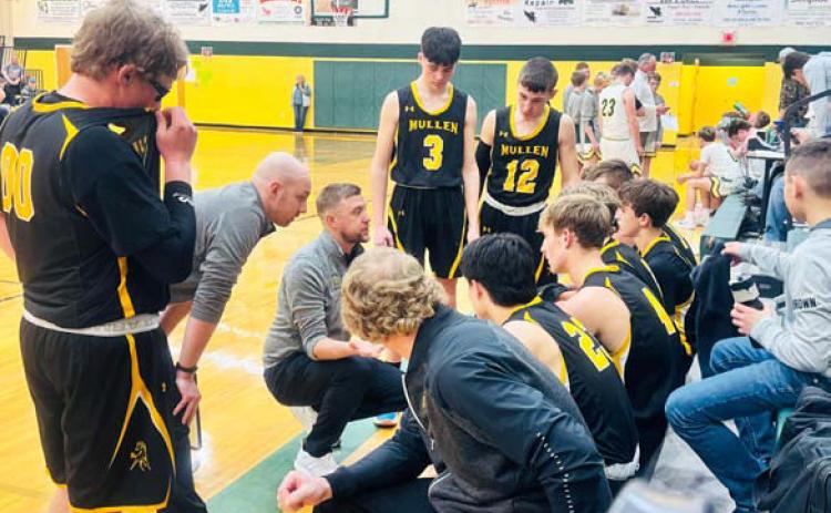 L-r: Coaches Dan Young, Darrick Hanks and Brad Wright talk to their team last week at Hay Springs. Carolee Brown