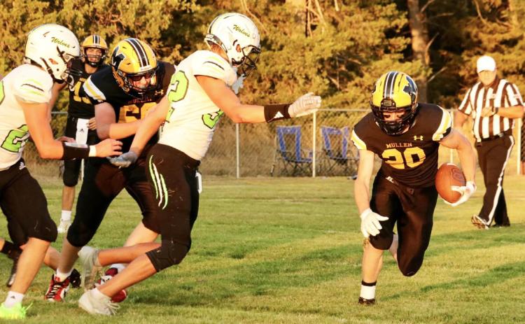 Senior Justin French carries the ball last Friday night. Carolee Brown
