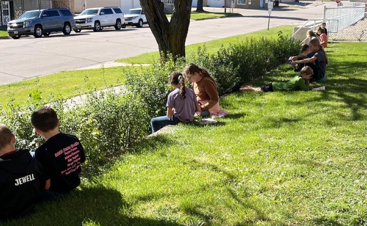 The Mullen fifth graders took advantage of the nice weather last Friday and spent their “Free Read Friday” enjoying a book in the sunshine. Emily Stichka