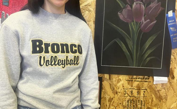 Bella Brown with her 1st place chalk drawing.