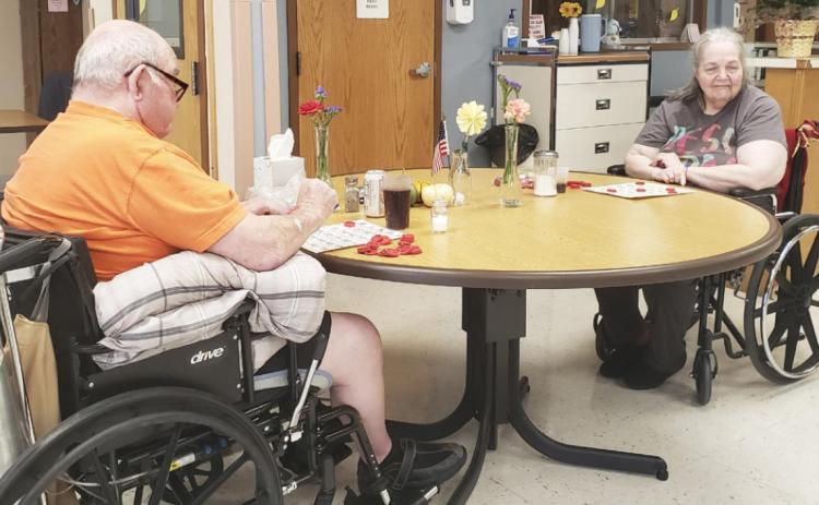 Stan Boyer and Ann Connell playing Bingo.