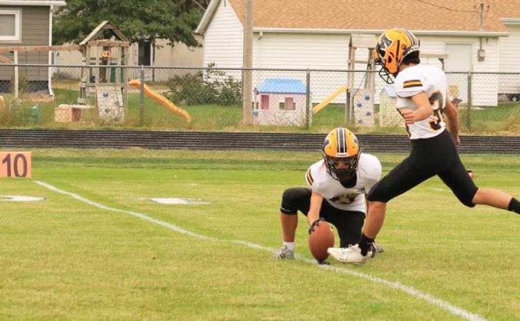 Ben Werner holds the ball for a Nicholas Gonzalez PAT kick. Carolee Brown