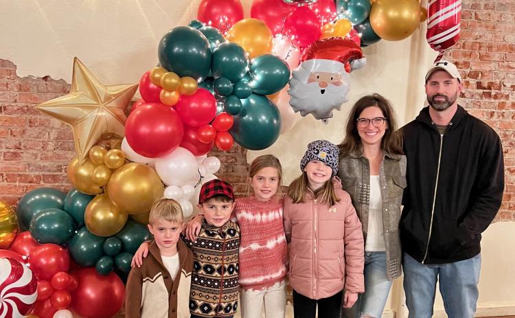 The Seeley family is pictured in front of one of their creations at Christmas Parade of Lights last year in Alliance, l-r: Tate, Brogan, Madelyn, Clara, Meg and Jake. courtesy photos