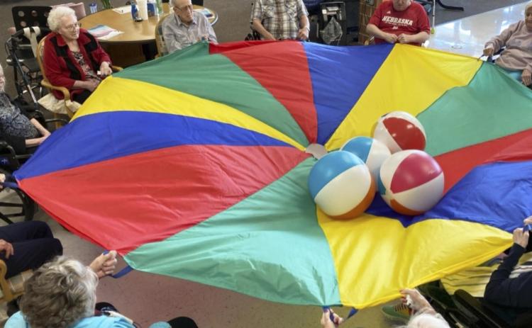 The residents enjoy the parachute!