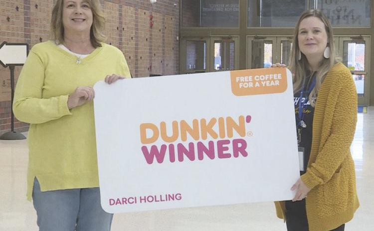 Darci Holling (right) was presented with her award on Monday.
