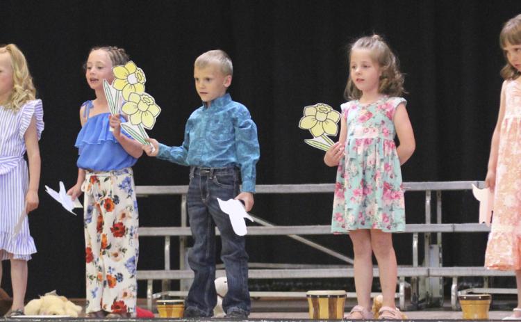 Kindergarteners singing Spring Again, l-r: Danielle Peterson, Fallon Lee, Dailie Dent, Trent Cox, Eve Ericksen, Aislynn Connealy, Ellie Licking.