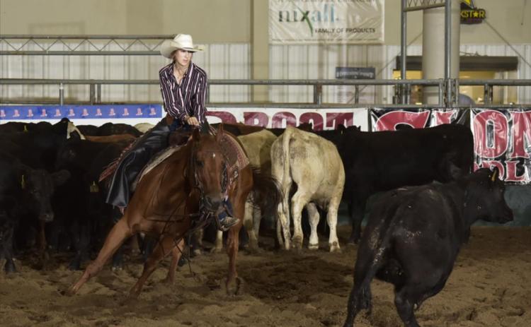 Whitney Jennings competing in girls cutting at Nationals. Acentric Rodeo