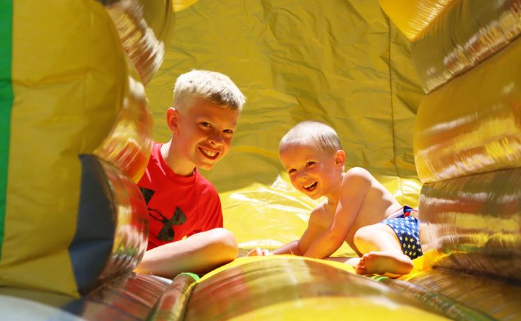 Two of Lyle and Twila Phillips’ grandsons, Cameron Plummer and Trey Carlton, enjoy one of the bounce houses that was set up at the Hooker County Fairgrounds during the Mullen Fun Day on the 4th of July. Gerri Peterson