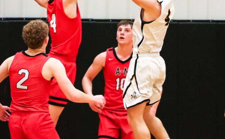 Alex Werner with a jump shot against Anselmo-Merna. Carolee Brown Photography