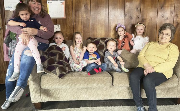 Pictured left to right on Monday at Lots of Love Day Care: Lori Folk holding Ellianna Collins, Brogan Jewell, Aurora Polt, Chasin McIntosh (sister Ady was sleeping), Arthur Polt, Ryhme Pettit, Ryann Walz and “Grandma” Ruby Folk. Gerri Peterson