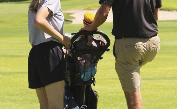 Coach Bo Cribelli talking to Chloe Wiese about her next shot at the Creek Valley Invite. Maci Walz