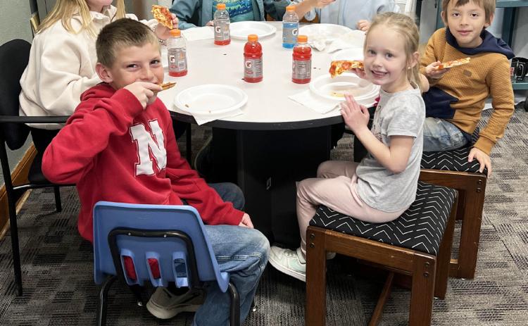 Pictured around the table from front left: Luke Cox, Tatum Deibler, Kendall Phipps, Fallon Lee, Austin Smith, Aurora Polt. Brett Mauler