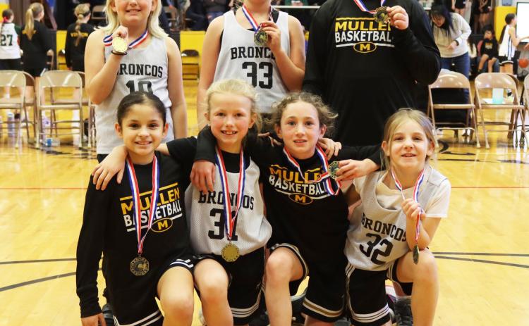 The Mullen 3rd/4th grade girls won their division of Hoops in the Hills, held at the Lariat on Saturday, Jan. 24. Pictured back, l-r: Daryl Deibler, Danielle Peterson, Tatum Deibler. Front: Abigail Gonzalez, Fallon Lee, Dailie Dent, Eve Ericksen.