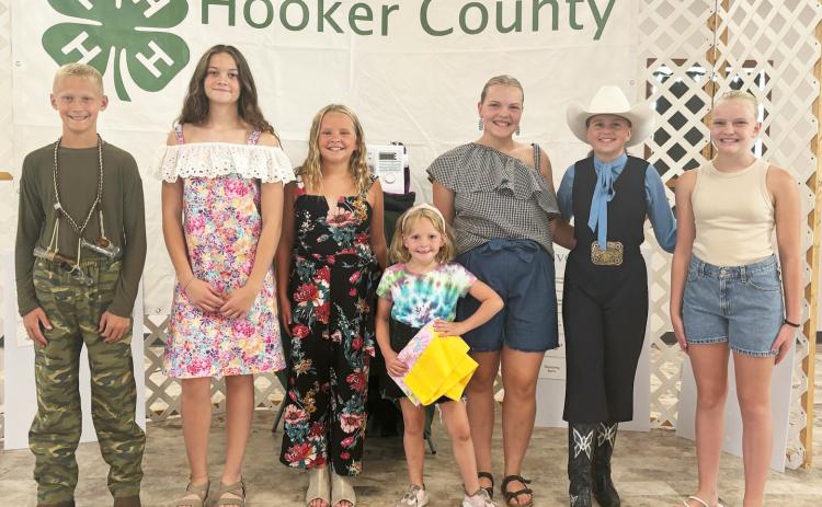 4-H Style Revue participants, l-r: Teal Peterson, Ava Kvanvig, Ella Walz, Ryann Walz, Maci Walz, Audrabell Werth, Ava Walz. Gerri Peterson