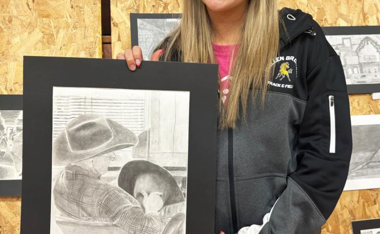 MHS senior Izzy Hoyt was the top senior high artist at the Mullen Art Show last Tuesday, April 15, by earning the most points. She is pictured with her personal favorite piece she had in the show. Mullen Senior High and Mullen Junior High both placed first in the show. Full results were not available at press time, but watch next week’s issue for them. Gerri Peterson