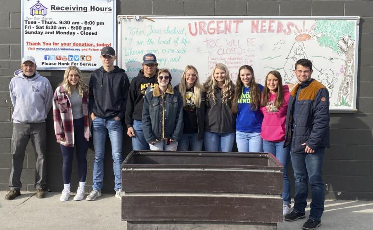 NHS members pictured with the Open Door Mission representative, l-r: Taylor Svoboda, Clayton Moore, Deacon DeNaeyer, Hailey Phipps, Alli Loughran, Faith Miller, Jordyn McDowell, Callie Coble, Samuel Coble. Megan Andersen
