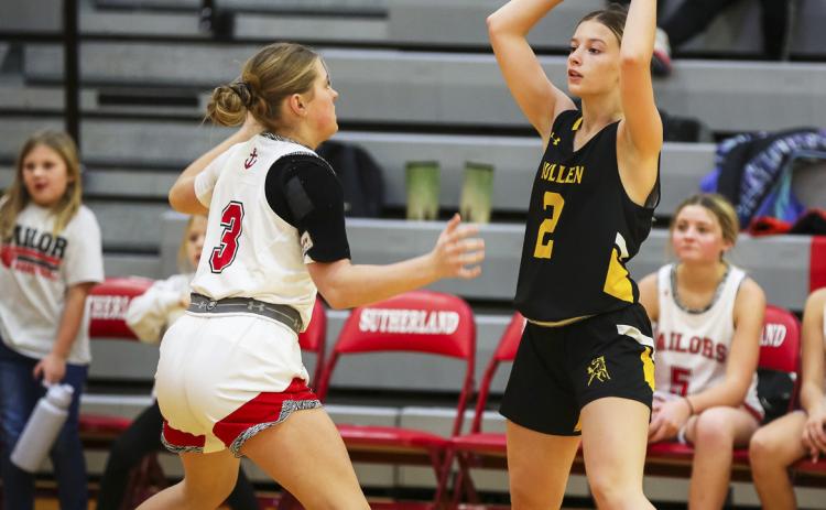 Erika Massey looks for a teammate to pass to in Sutherland. Megan Andersen