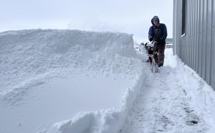How do you eat an elephant... or a snowdrift bigger than your snowblower? A little at a time! Dane Peterson is pictured working on clearing the sidewalks at the Hooker County Community Center last Thursday morning. Gerri Peterson