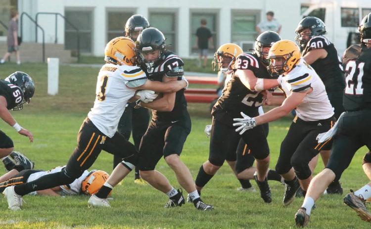 Cian Connealy with a tackle at Twin Loup. Carolee Brown Photography