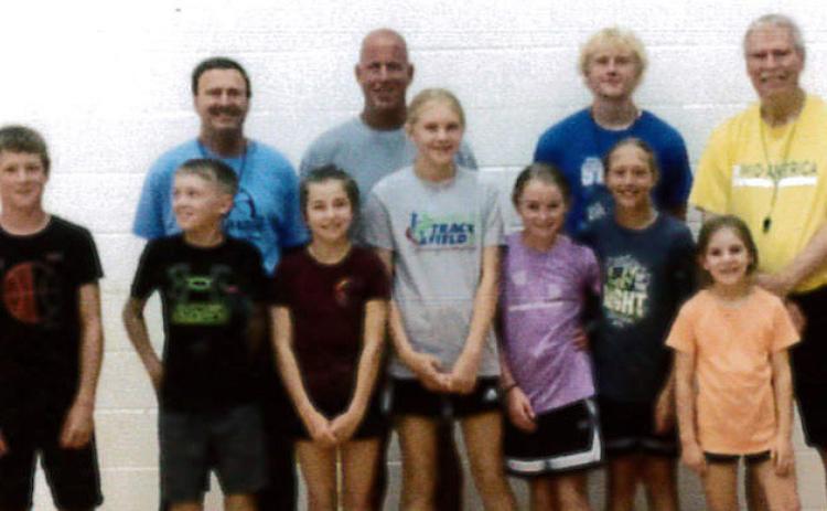 Back, l-r: Coaches Bill Gavers, James Lowry, Riley Bombeck and Mike Trader. Front: Cylas Dent, Kyler Marsh, Lillian Ericksen, Hadley Marsh, Avery Vinton, Emri Dent, Eve Ericksen. courtesy photo