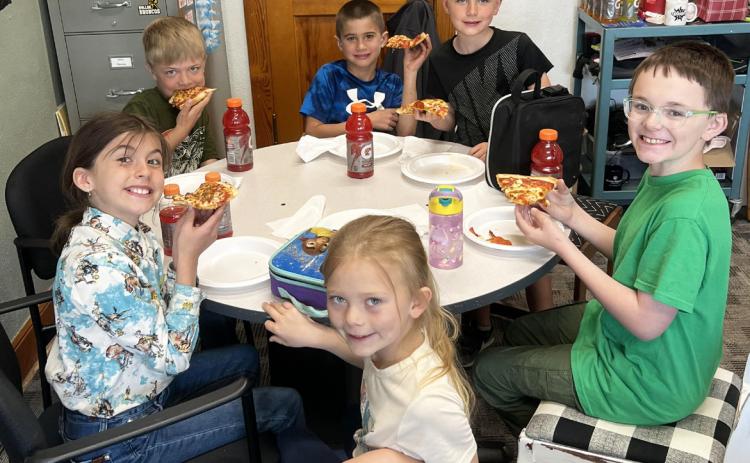 Pictured clockwise around the table from the left: Finley Mundorf, Killian Kearns, Tru Mundorf, Tate Phillips, Samuel Hessin, Brystol Call. Brett Mauler