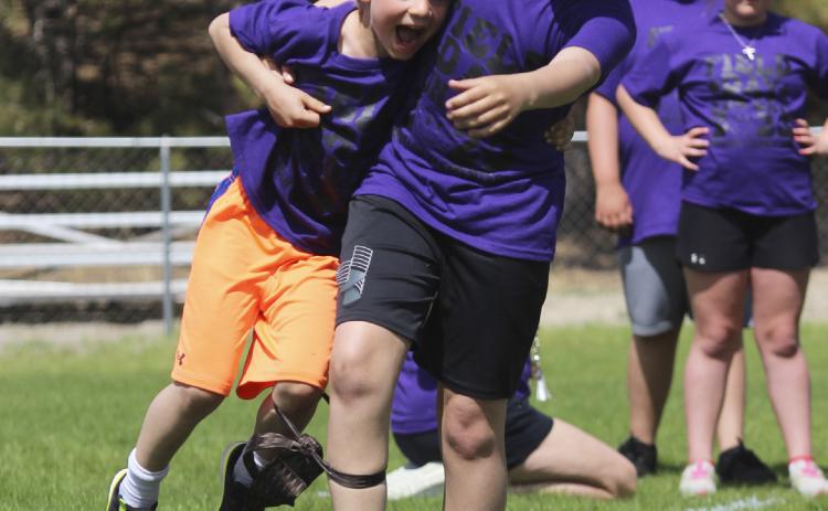 Hold on Killian! Fifth grader Colin Connealy took the threelegged race to a whole other level last week at the Mullen Elementary Field Day when he hoisted his teammate, first grader Killian Kearns, up and just carried him instead! Gerri Peterson