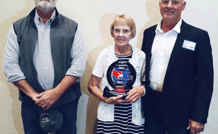 Receiving the Circle of Honor award in Gary Hoyt’s honor were his wife Carolyn Hoyt and sons Todd (left) and Phil Hoyt. courtesy photo