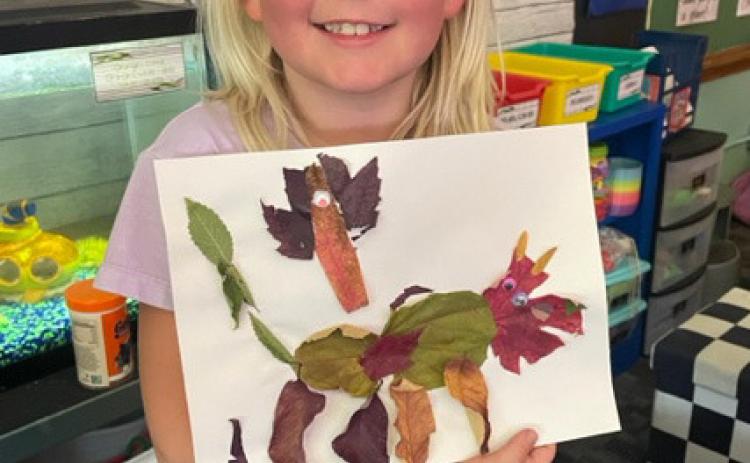 The 2nd grade students recently went on a leaf hunt to find the perfect leaves to create a leaf animal. Pictured is Daryl Deibler.