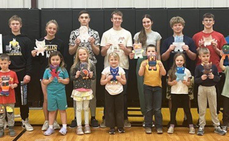 Freshmen create personalized monsters for kindergartners