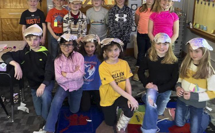 In science, the 2nd grade students explored the different properties of materials used for clothing, such as texture, flexibility, and absorbency. Then they used this information to design and build a hat that protects them from the sun. They have also been practicing adding 3-digit numbers. Emily Brown