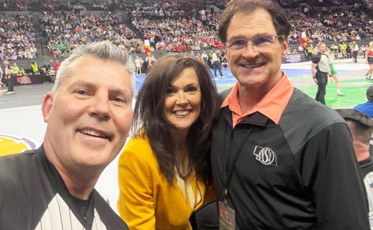 Bill and Robin Phipps at State Wrestling with Dale Bean of Kearney (left) who was honored for 25 years as a referee. courtesy photo