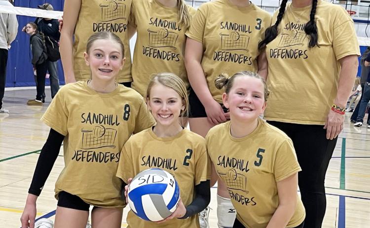 Sandhill Defenders 13U team, back l-r: Hadley Marsh (13), Ava Walz (13), Lilly Morrow of Dunning (12), Coach Barb McIntosh. Front: Kendall Phipps (12), Ayden Lee (12) &amp; Ella Walz (11).