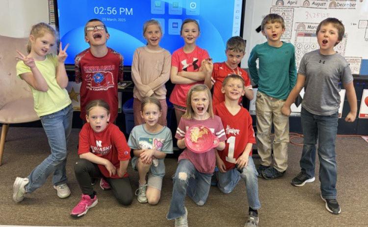 First graders learn how to make butter