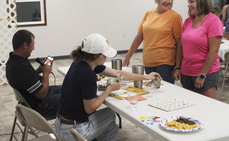 Bingo hosts Ryan and Shelby Ridenour tried to get Diana Brost and CeCe Coons (right) to have a dance off to determine the $50 final Bingo game prize winner, but despite Ryan’s stellar music choice, they decided to split the money instead. Gerri Peterson