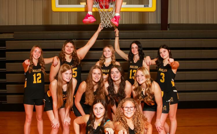 Girls basketball: Peyton Paxton on the hoop, back l-r: Harper Andersen, Mia Flores-Green, Hayley Donohoe, Fayth Brown, Georgia Wingebach. Middle: Chloe Newman, Brynne McCully, Jenna Donohoe, Emerson Thorberg. Front: Kalli Licking, Riley Hegland. Megan Andersen Photography