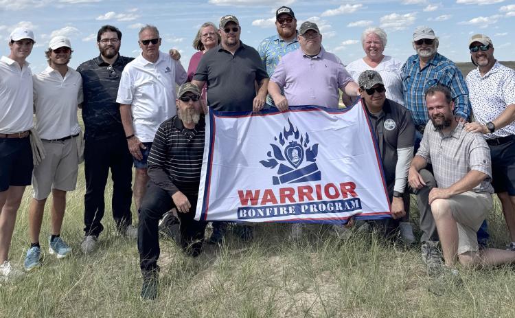 Pictured is Jeremey Johnson, Mike Diehn, Joey Garrido, Zach Friel, Johnny Raines, Denis Oliverio, Sally Sherman-Ruelas, Vicki McClain, Mike Foss, Gregg Mallory and caddies Chase and Brady at Sand Hills Golf Club. courtesy photo