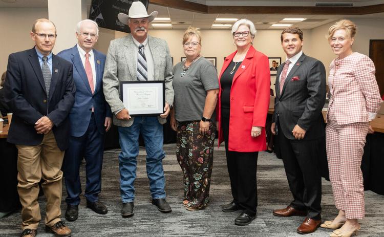 John Nollette (third from left, with his wife Stacy next to him) received a Kudos Award during the June 18 meeting of the University of Nebraska Board of Regents. courtesy photo